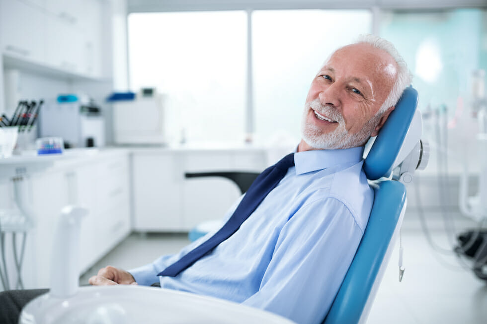 mature man in dentist chair